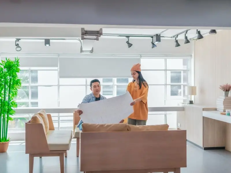 First-time home buyer in Georgia reviewing floor plans and evaluating home features